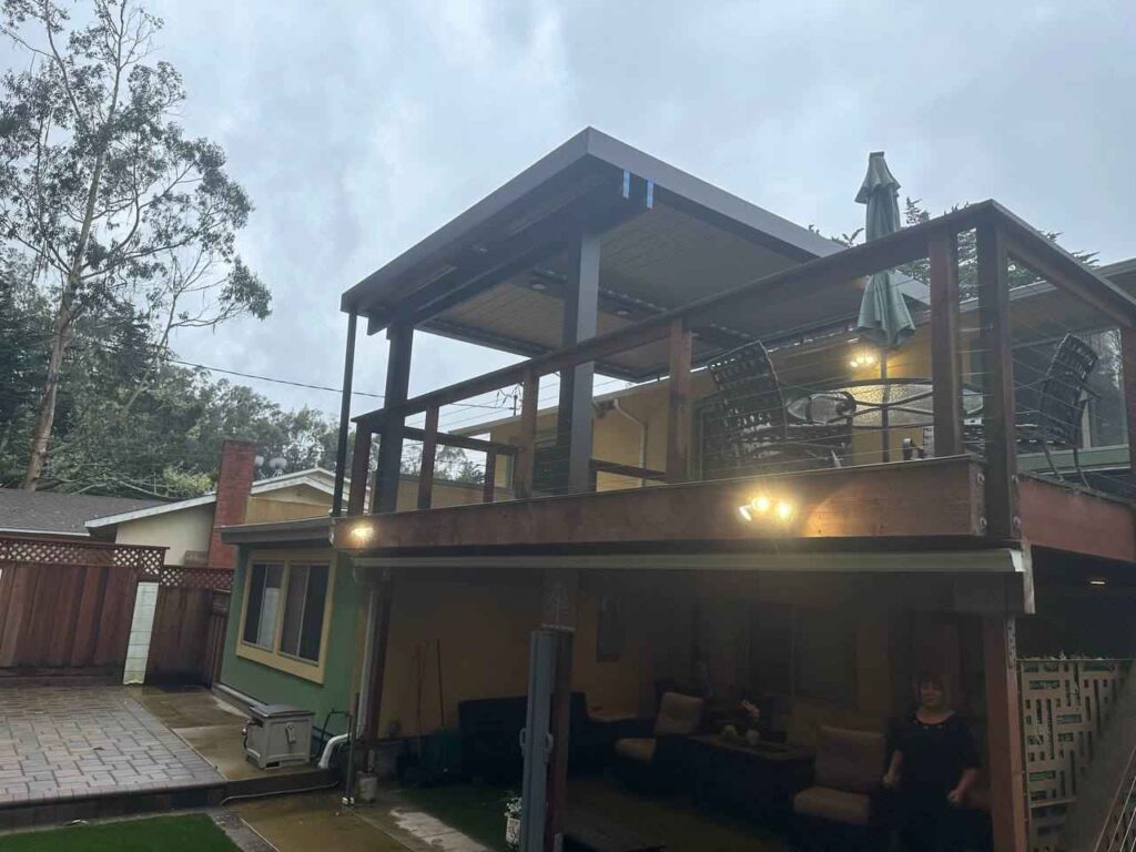 Outdoor deck in Sacramento, CA, with a roofed patio area and an open deck