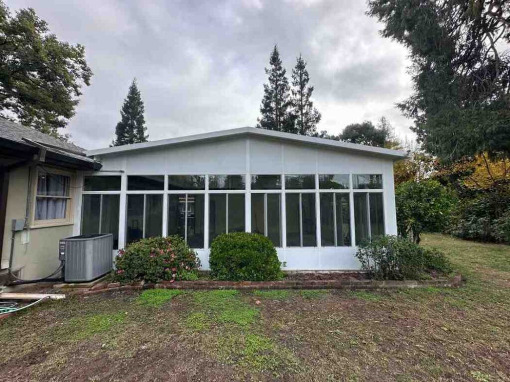 Modern custom sunroom with glass walls and insulated roof in Sacramento, CA