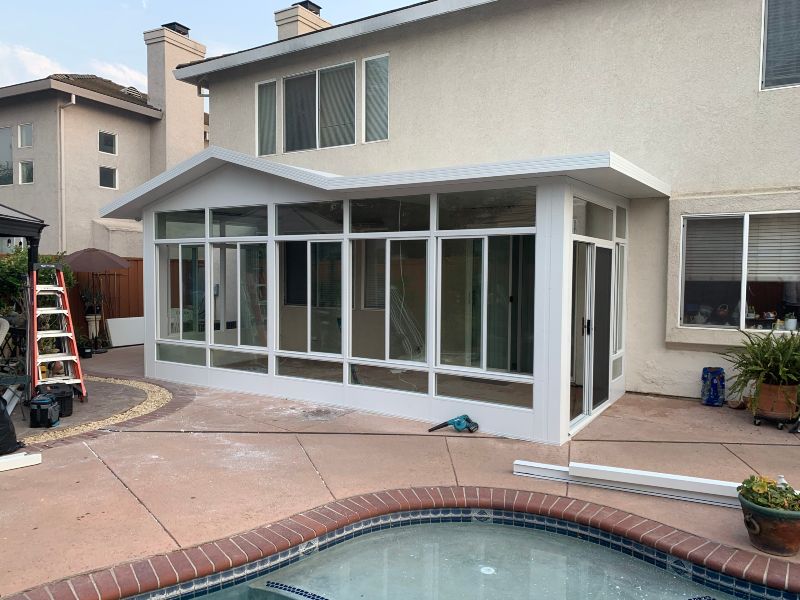 Cozy Screened-In Porch Featuring a Sliding Door, Ideal for Relaxing in Sacramento, CA